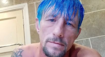 Darren Withmore, prófugo de la justicia, responde a críticas de su pelo azul en post de la Policía