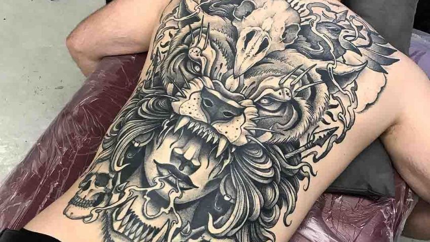 Deja que el peligro recorra tu espalda con estas impactantes ideas de tatuajes para hombres