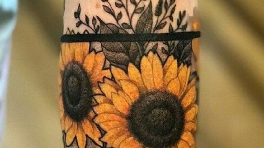 Demuestra tu fortaleza con estos tatuajes para hombres en el brazo de flores de girasol