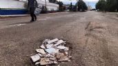 Foto ilustrativa de la nota titulada  Vecinos tapan baches con azulejos en Navojoa; llaman a atender la problemática