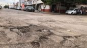 Foto ilustrativa de la nota titulada Recientes lluvias 'desnudan' el mal trabajo de bacheo hecho en calles de Navojoa