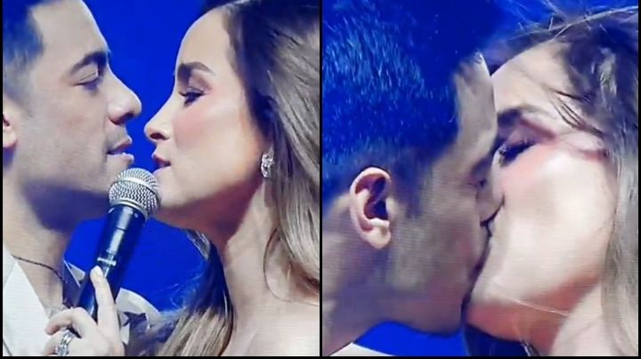 Carlos Rivera y Cynthia Rodríguez sellan su amor con apasionado beso en pleno concierto