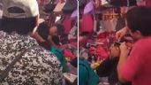 Foto ilustrativa de la nota titulada: (VIDEO) Comerciantes detectan a presuntas ladronas y las rapan en un mercado de Puebla