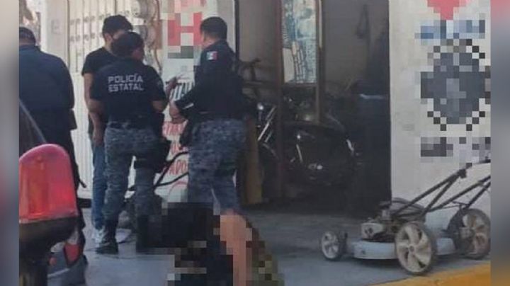 Pistoleros aniquilan a dos en taller de motocicletas; una mujer logró salvarse