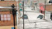 Foto ilustrativa de la nota titulada VIDEO: Violenta lluvia sorprende a Puebla y provoca ríos de granizo en las calles