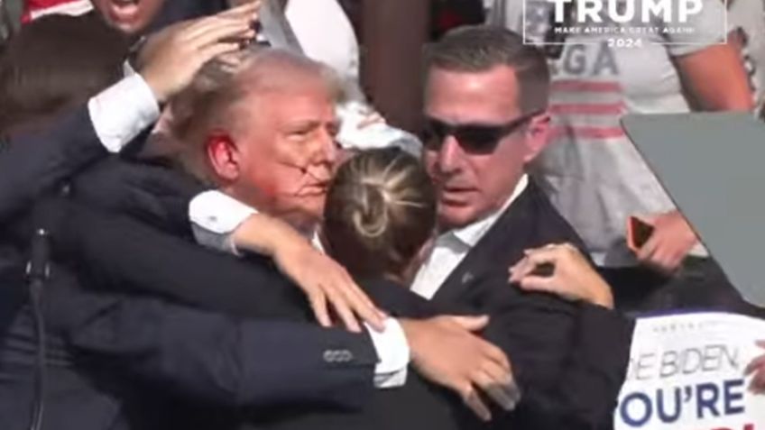 Atacan a balazos a Donald Trump durante acto de campaña; captan tiroteo en VIDEO
