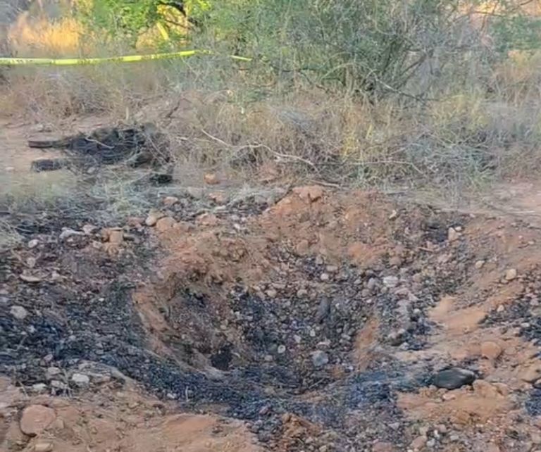 Una de las fosas encontradas en el lugar de los hechos